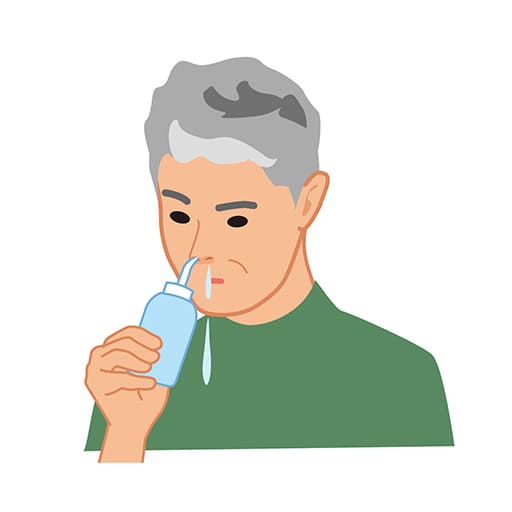 鼻うがいをしている男性